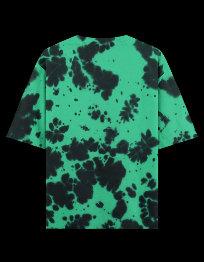 Back of Green and black tie-dye t-shirt with a Blaze Couture embroidered logo on a black background