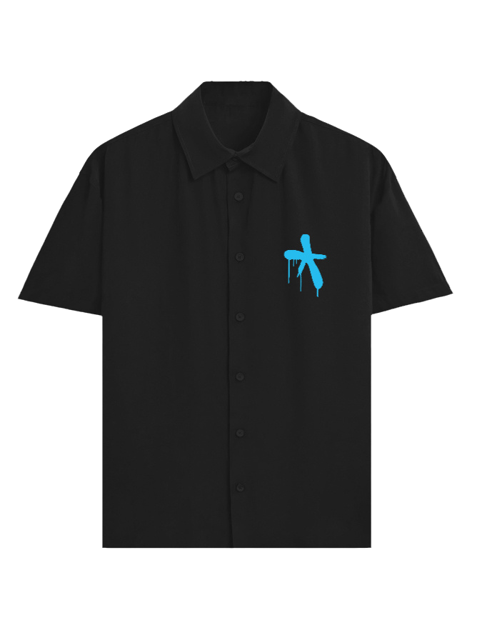 A black short-sleeve button-up shirt with a small blue graffiti-style cross graphic on the left chest, displayed on a clean white background.