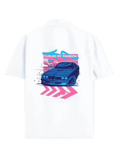 A white short-sleeve button-up shirt shown from the back, featuring a colorful graphic print of a blue sports car with pink and blue graphic elements and the text 'FUELED BY PASSION'.