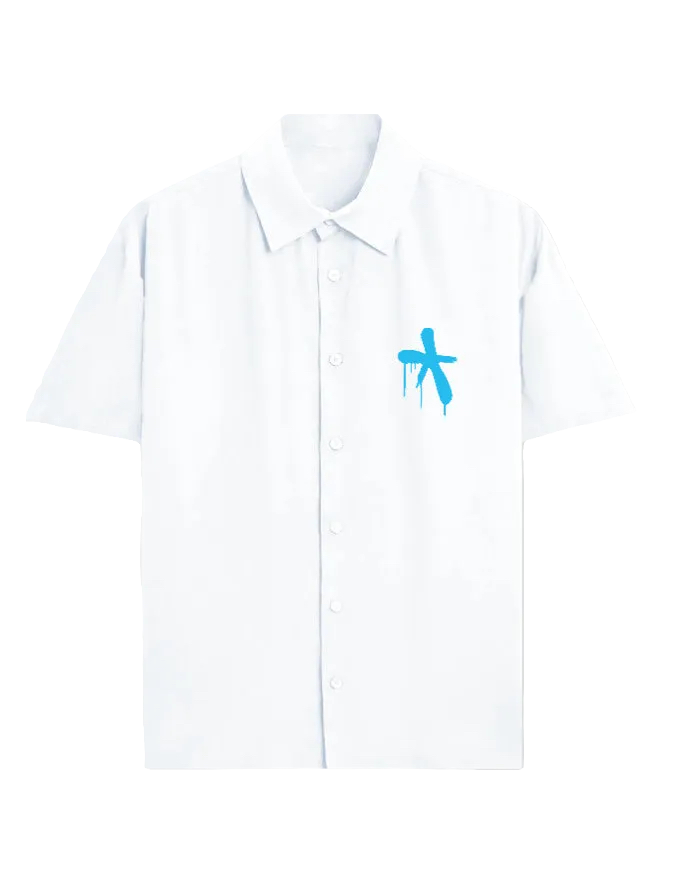 A white short-sleeve button-up shirt with a small blue graffiti-style cross graphic on the left chest, displayed on a clean white background.
