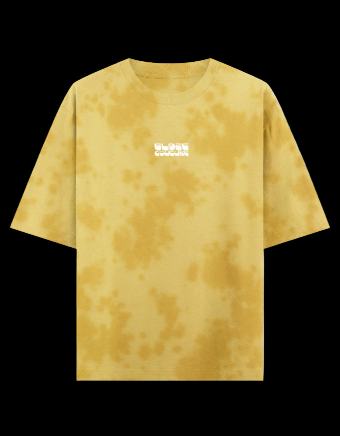 Yellow tie-dye t-shirt with a Blaze Couture embroidered logo on a black background