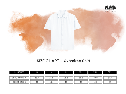 An oversized white short-sleeve shirt centered on a white background with a soft orange watercolor splash behind it. Below the shirt is a size chart labeled 'SIZE CHART - Oversized Shirt' with columns for S, M, L, XL, XXL, and 3XL showing measurements in inches.